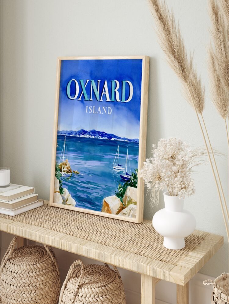 Framed Oxnard Island travel poster in a living room, highlighting its coastal charm.