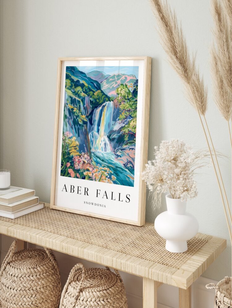 Aber Falls travel poster in a sleek black frame, displayed against a light wall.