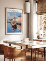 Aberaeron Wales travel poster in a black frame, hanging above a console table in a minimalist hallway.
