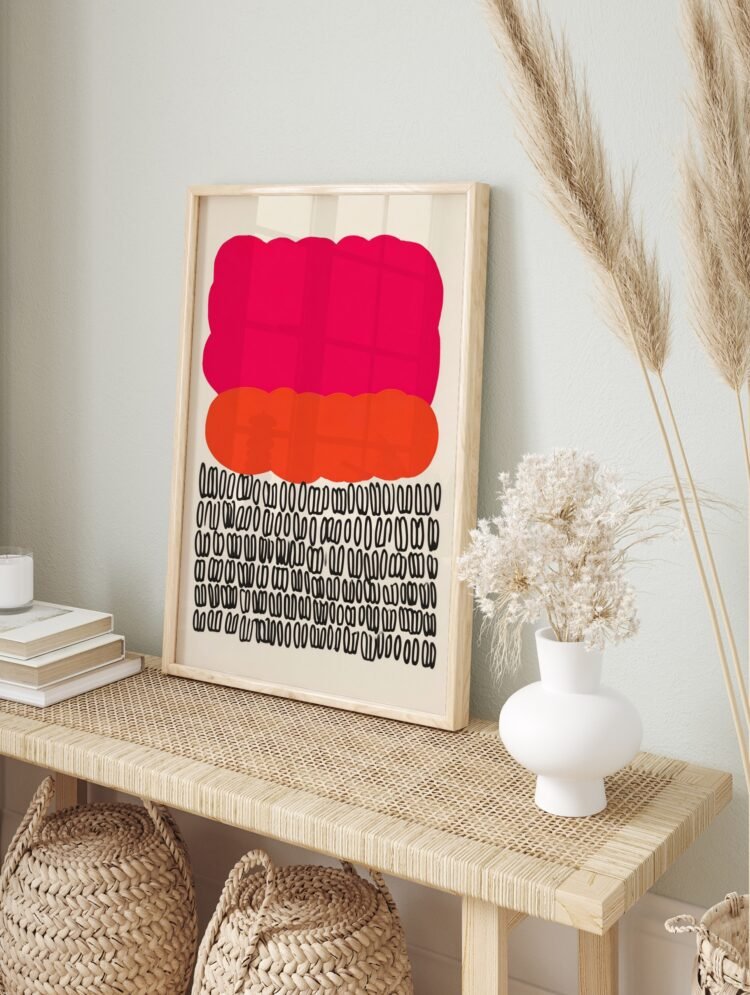 Abstract art print in a modern wooden frame, showcasing pink, orange, and black organic shapes.