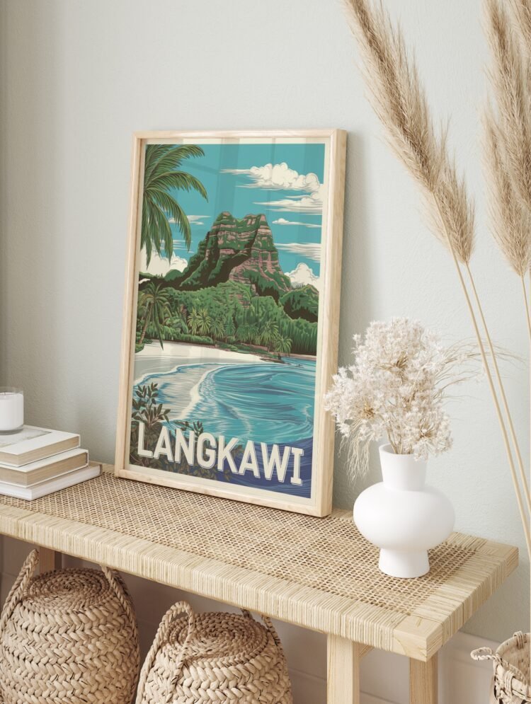 Framed Langkawi travel poster depicting a tropical beach and mountain, displayed in a bright, modern living space.