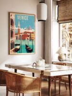 Venice Italy travel poster in a classic gold frame, hanging above a console table with decor.