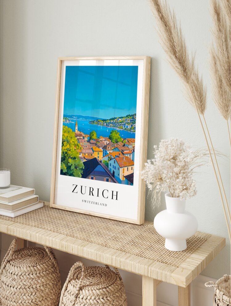 Zurich Switzerland travel poster in a white frame displayed on a plain wall, showcasing the lakeside cityscape.